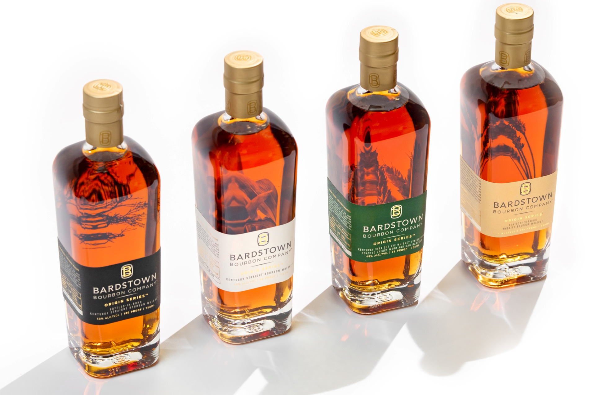 A lineup of Bardstown Bourbon Company's Origin Series bottles, showcasing different whiskey styles with distinct labels.