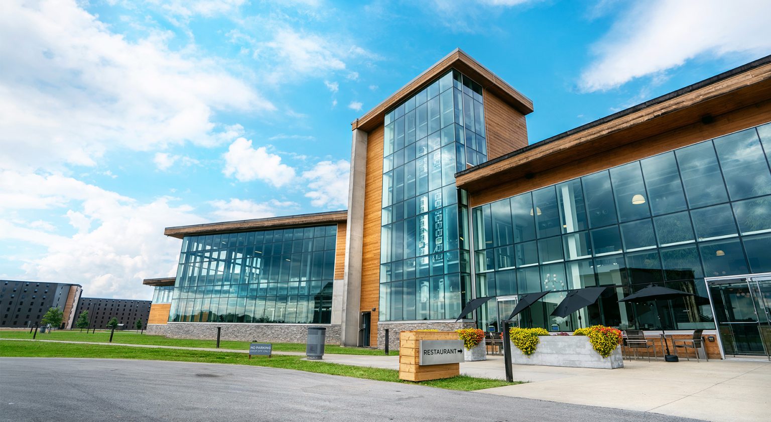 Bardstown Bourbon Company distillery in Kentucky with copper stills and aging barrels on site.